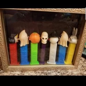 Vintage PEZ Dispenser in display case. SKULL, GHOST, PUMPKIN BUGS AND MORE